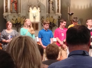 Ryan, middle in blue shirt, during PSR graduation at Sacred Heart Catholic Church in Valley Park, Mo., on Monday, May 6, 2013.